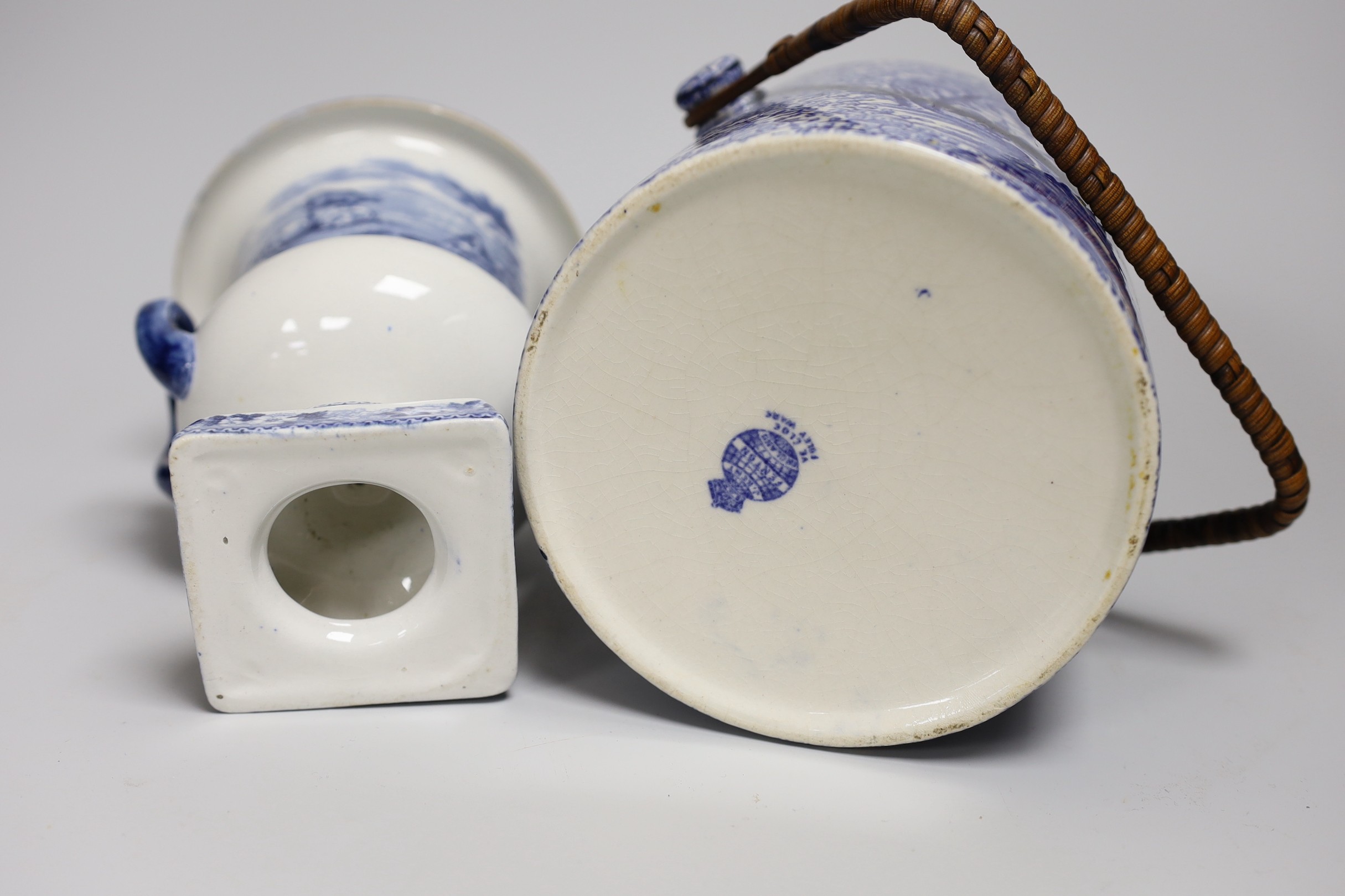 Blue and white pottery- A Victorian Willow pattern comport, a biscuit barrel and an urn with cover